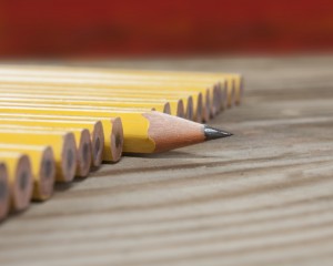 Pencils... one sharp surrounded by dull pencils